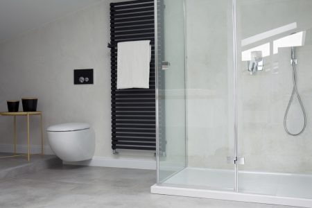Glass shower in bright bathroom